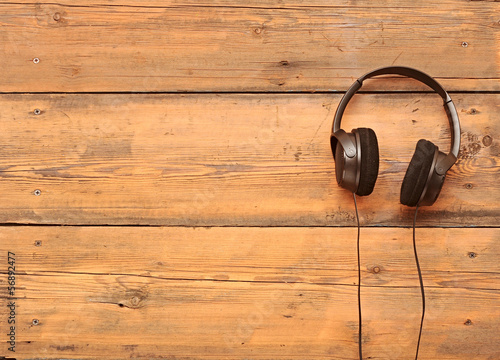 stylish headphones on a grungy wooden table