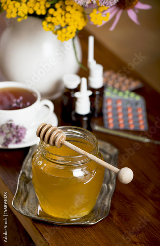 Still life from medicinal herbs, honey, herbal tea and medicines