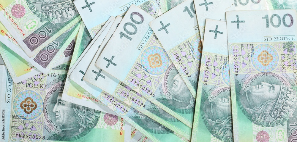 Naklejka premium 100's polish zloty banknotes as money background