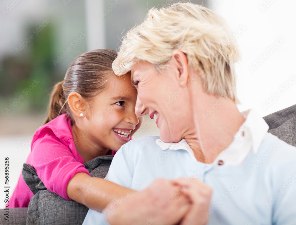 cute little girl hugging grandma cute little girl hugging grandma