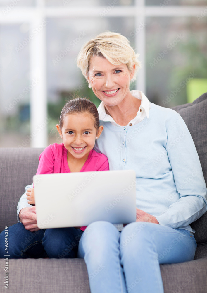 senior woman and her granddaughter using laptop senior woman and her granddaughter using laptop