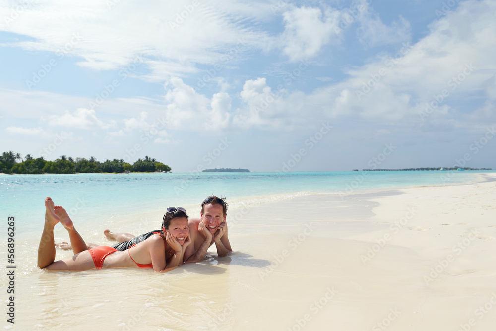 happy young couple have fun on beach happy young couple have fun on beach
