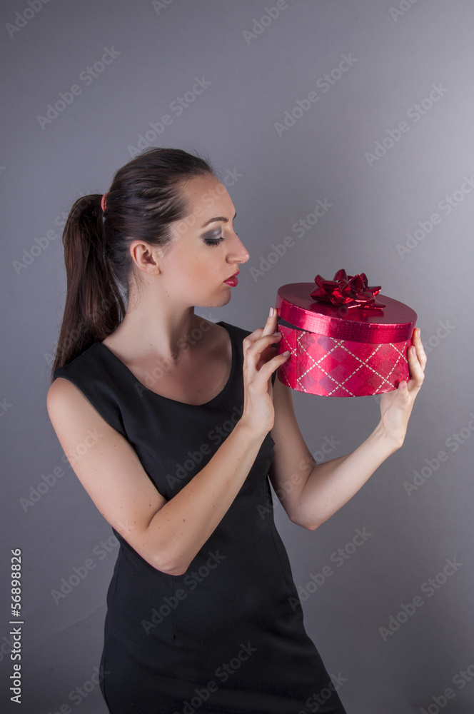 girl holding red gift box girl holding red gift box