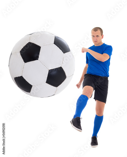 young soccer player in blue kicking ball isolated on white backg