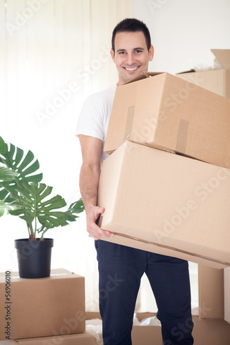 man carrying cardboard box