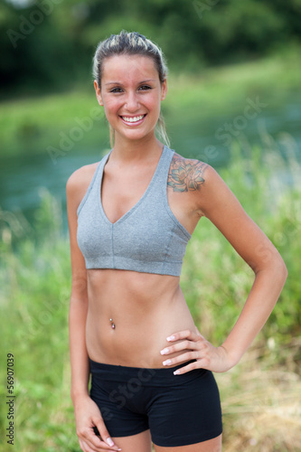 Portrait of blonde woman with running outfit