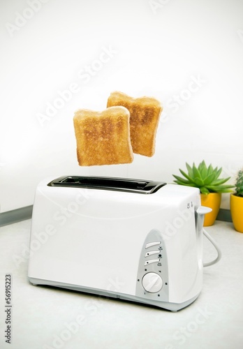 Jumping toasts. Prepare breakfast in kitchen