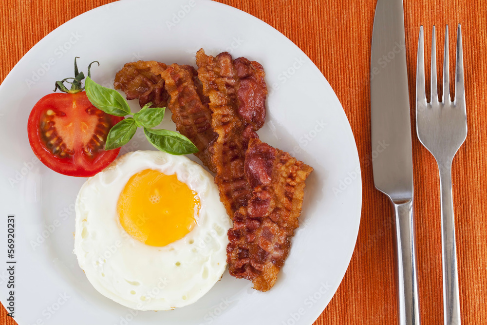 Fried egg and bacon for breakfast Fried egg and bacon for breakfast