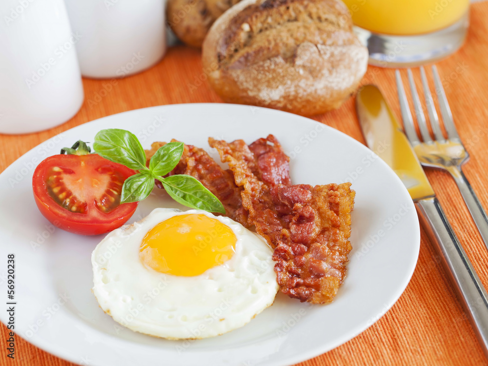 Fried egg and bacon for breakfast Fried egg and bacon for breakfast