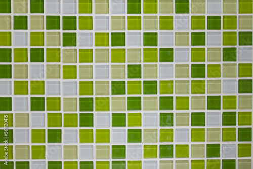 Green glass mosaic tiles wall in the kitchen