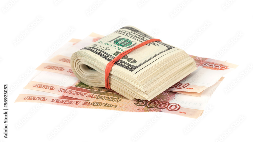 Folded dollar bills laying over rouble background Folded dollar bills laying over rouble background