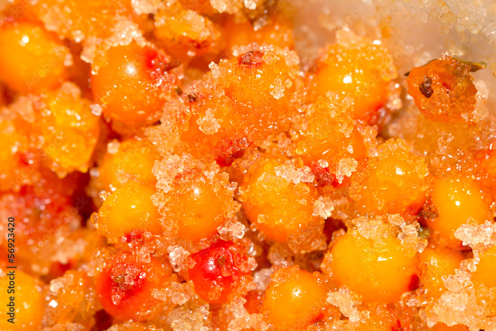 sea-buckthorn berries with sugar as a background sea-buckthorn berries with sugar as a background