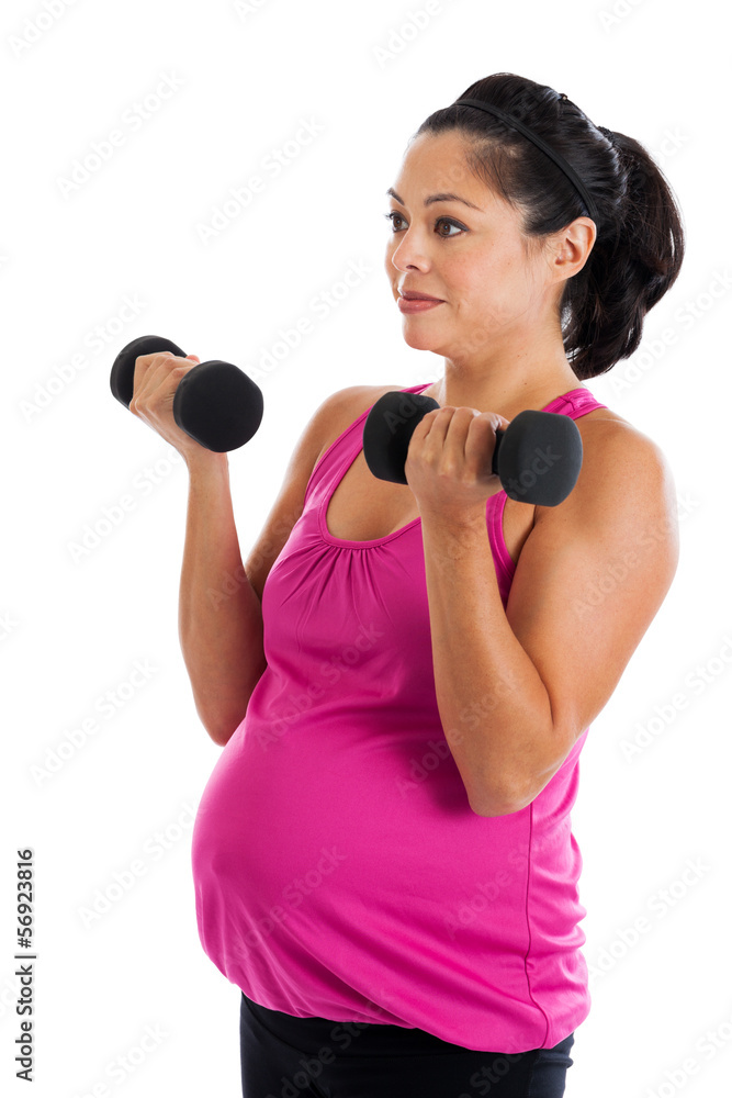 Fit Hispanic pregnant woman doing bicep curls Fit Hispanic pregnant woman doing bicep curls