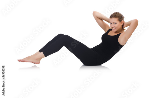 Young woman doing exercises on white © Elnur
