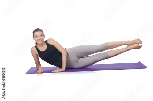 Young female doing exercises on white © Elnur