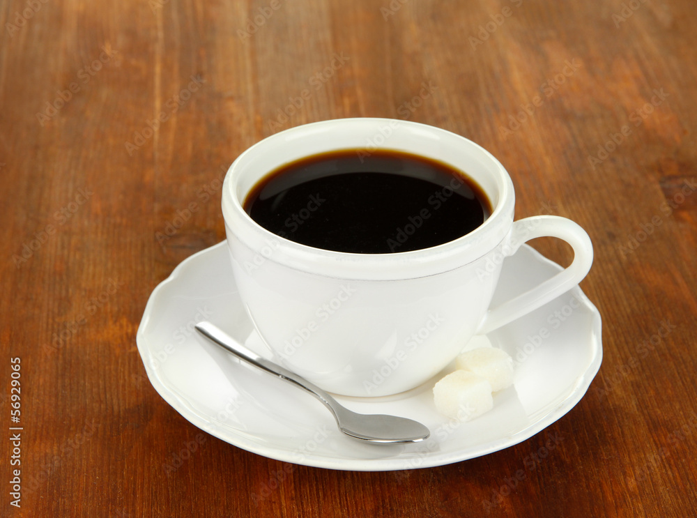 Coffee cup on wooden table close-up Coffee cup on wooden table close-up