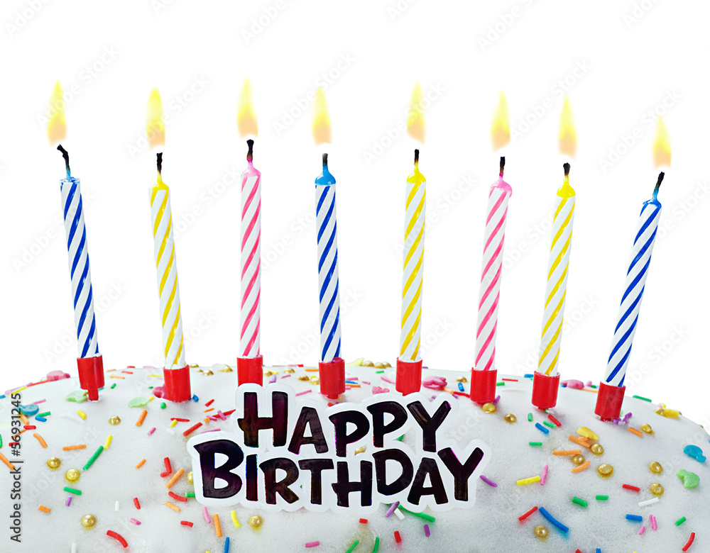 burning candles on a birthday cake on a white burning candles on a birthday cake on a white