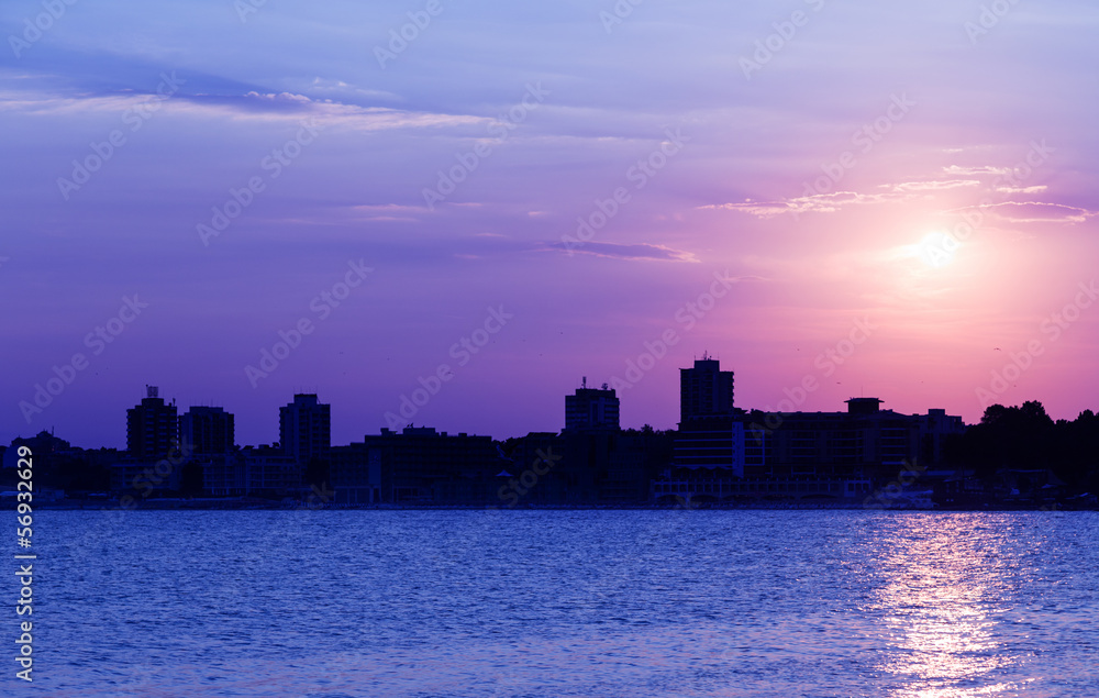 Sea sunset city