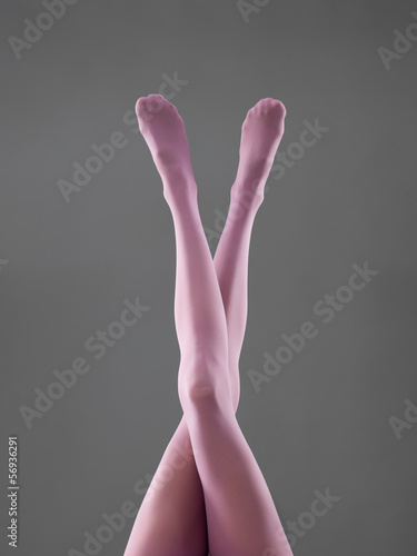 beautiful female legs in pink stockings