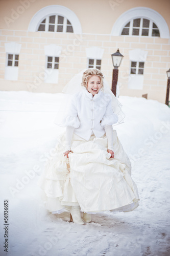 Beautiful bride in the park in winter