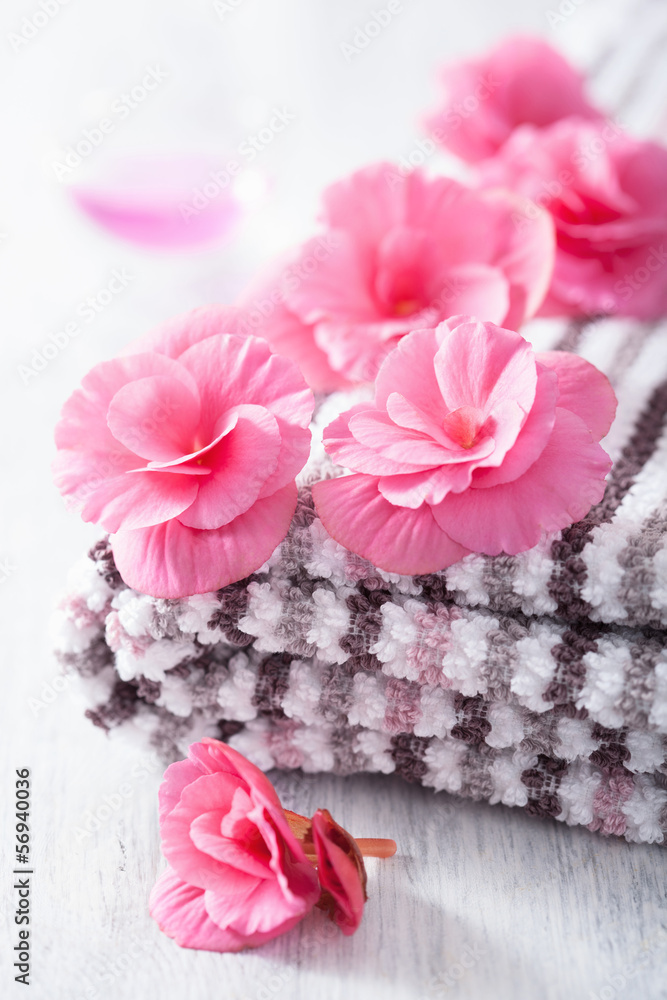 pink flowers and towel for spa pink flowers and towel for spa