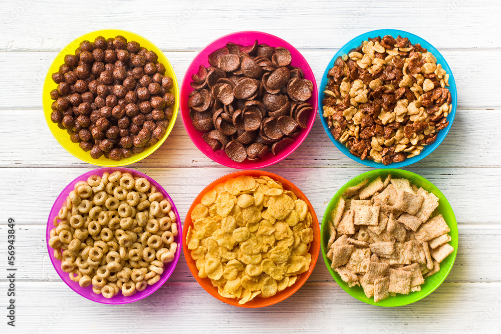 various kids cereals in colorful bowls various kids cereals in colorful bowls