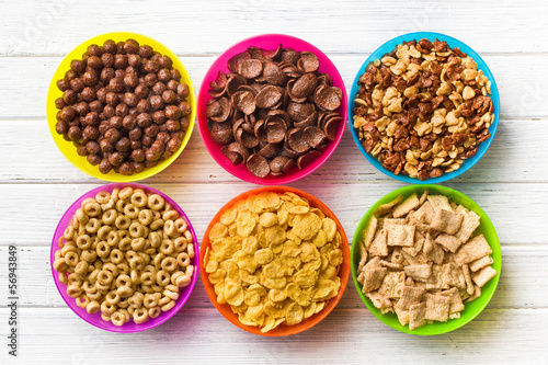 various kids cereals in colorful bowls
