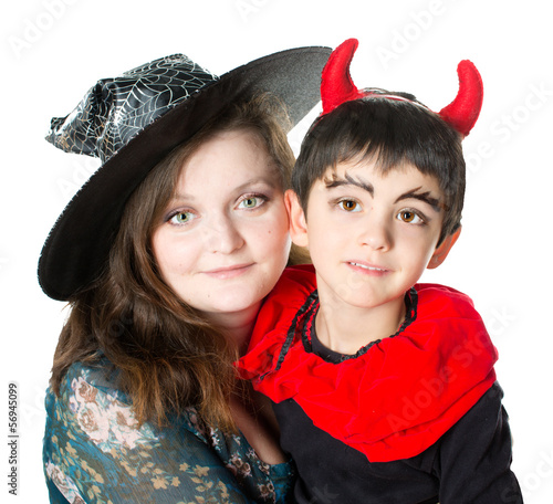 Mother wearing as witch, son wearing as devil. Halloween