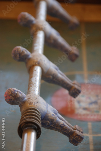 Fototapeta Naklejka Na Ścianę i Meble -  Blue Figures On Old Table Football