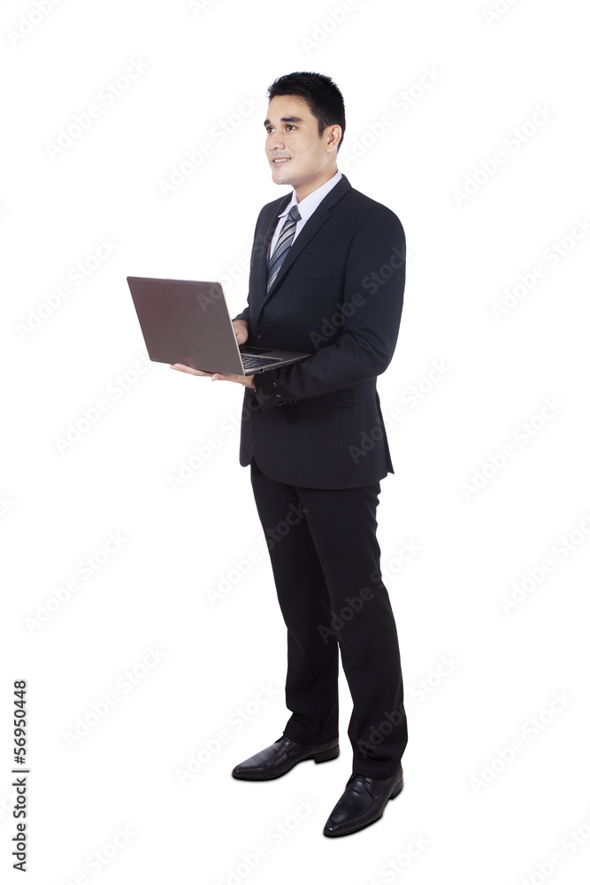 Businessman using laptop isolated on white Businessman using laptop isolated on white