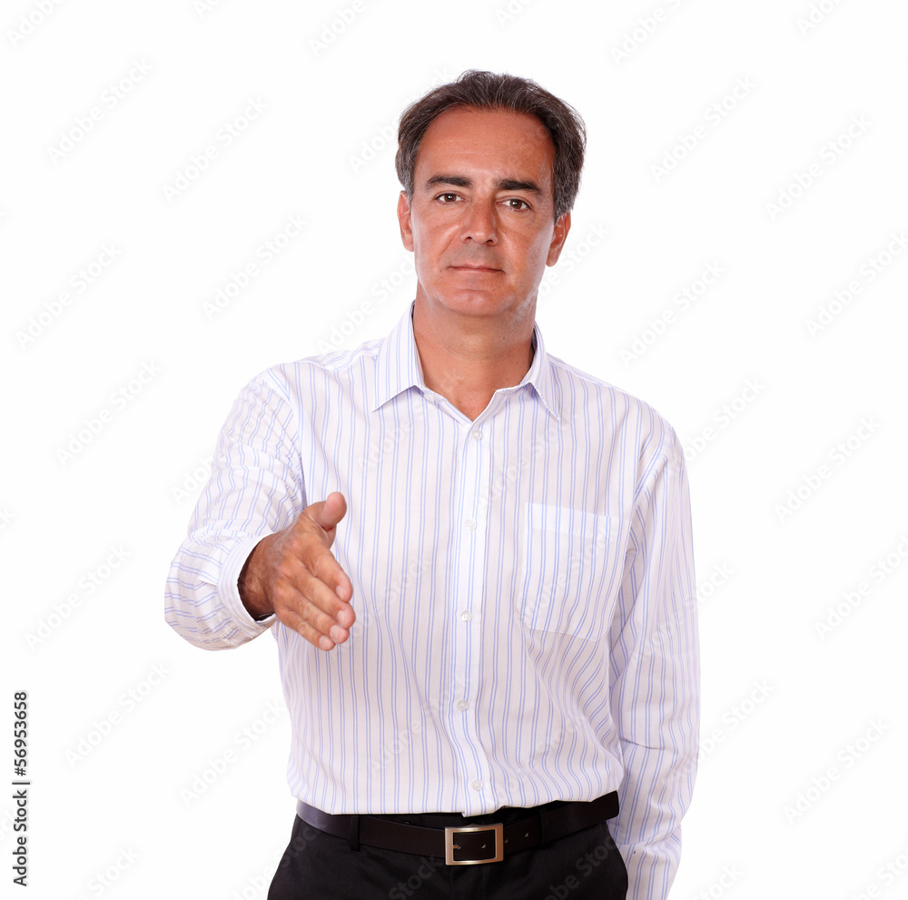 Serious hispanic man with greeting gesture Serious hispanic man with greeting gesture