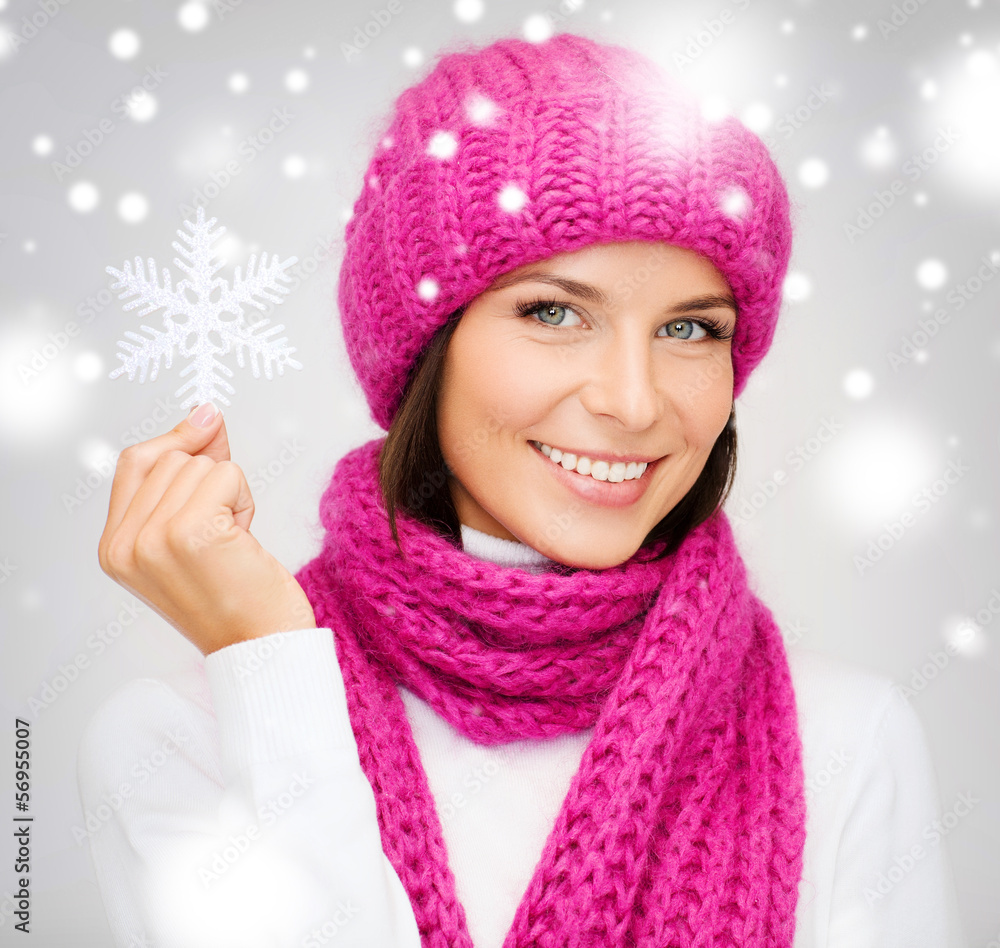 woman in hat and muffler with big snowflake woman in hat and muffler with big snowflake