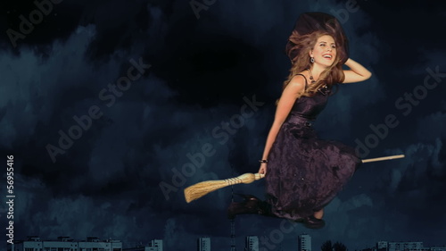 Witch woman flying on broomstick.