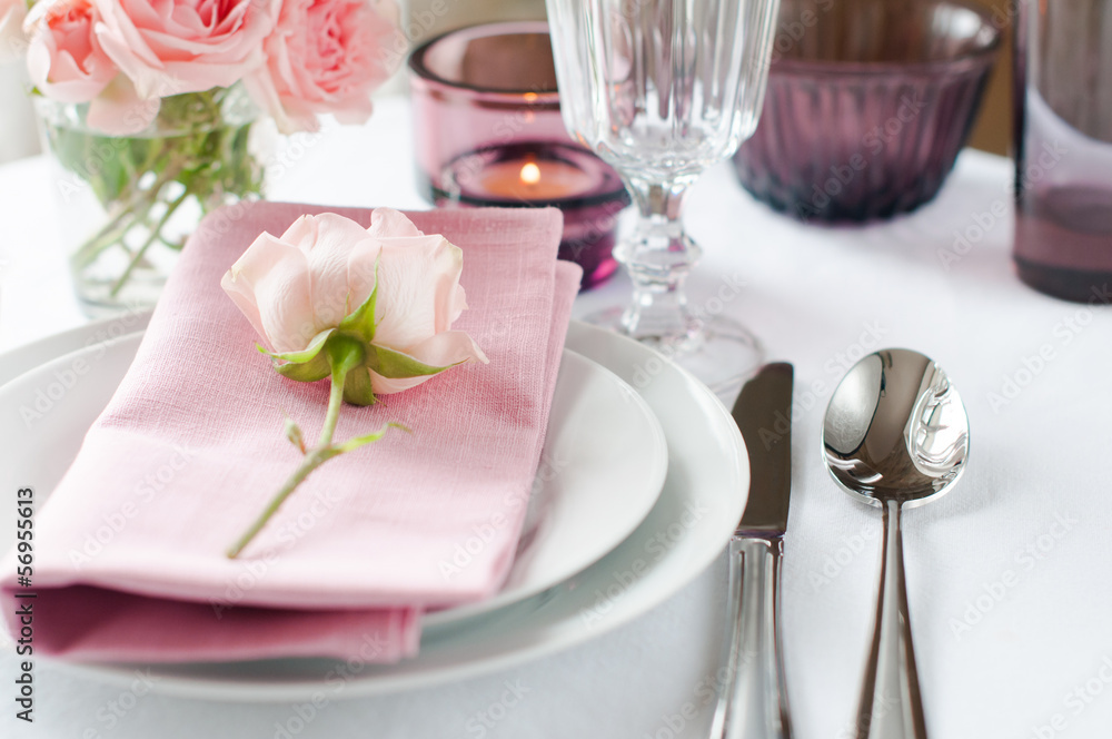 Beautiful festive table setting with roses Beautiful festive table setting with roses