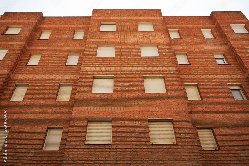 Multi-storey residential building of red brick Multi-storey residential building of red brick