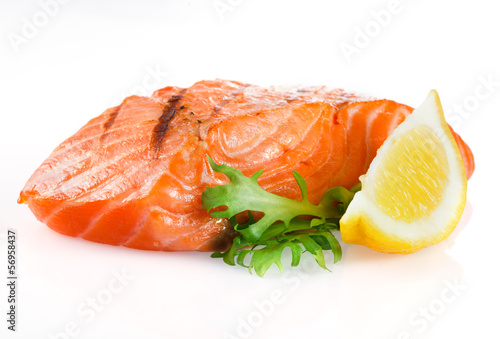 Grilled salmon with lemon on white background