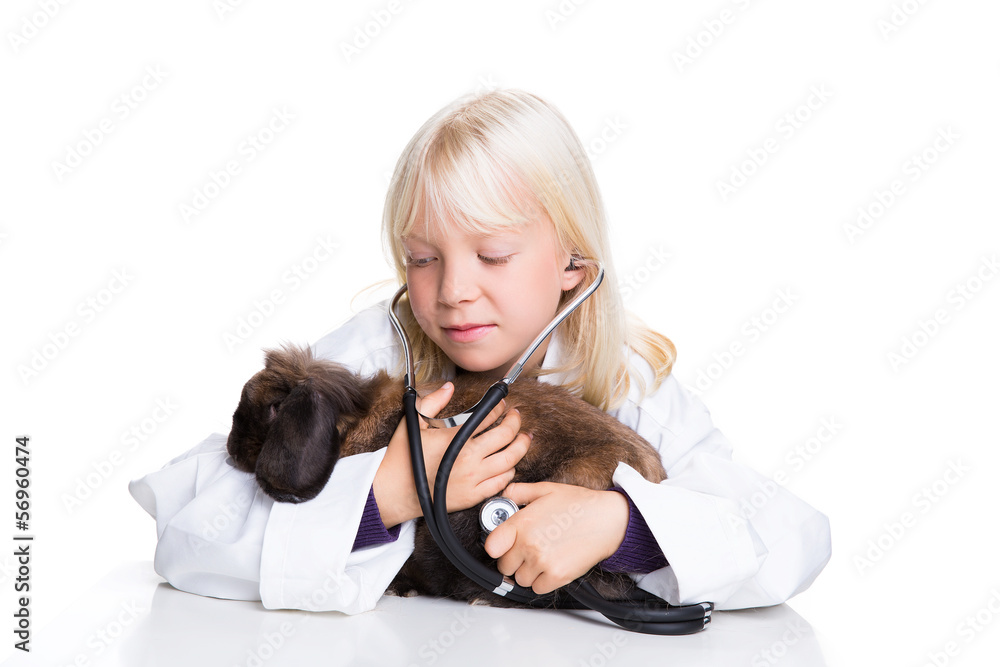 kleines Mädchen mit Berufswunsch Tierärztin kleines Mädchen mit Berufswunsch Tierärztin
