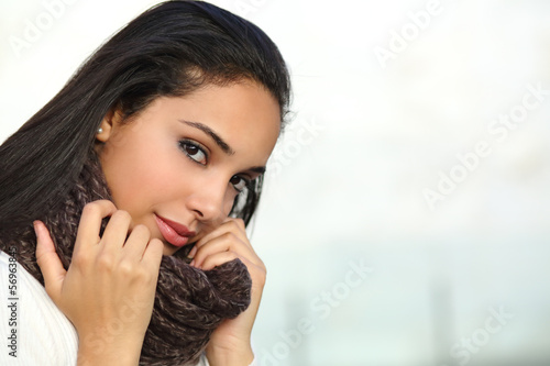 Portrait of a beautiful arab woman face warmly clothed