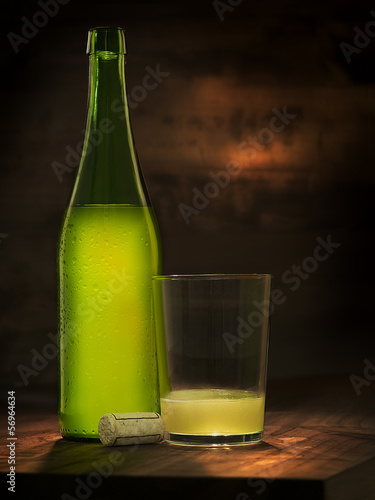 nice bottle and glass of natural and organic cider