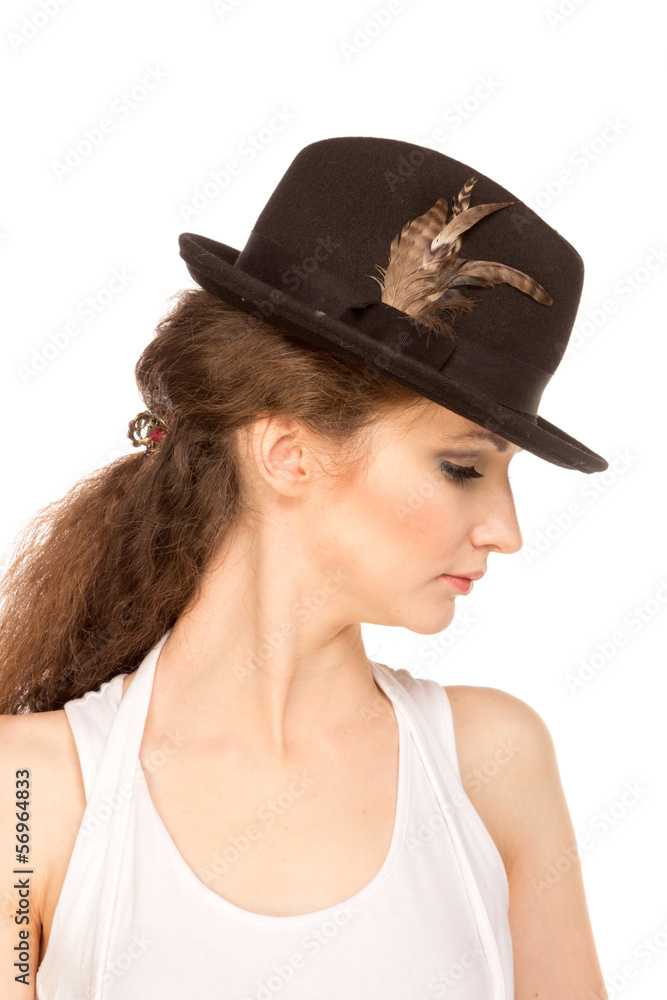Pretty woman in hat with bird's feather Pretty woman in hat with bird's feather