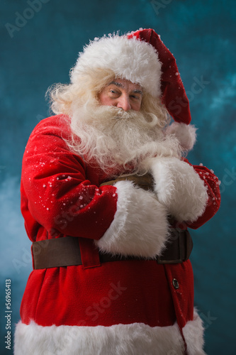 Santa Claus standing outdoors at north pole