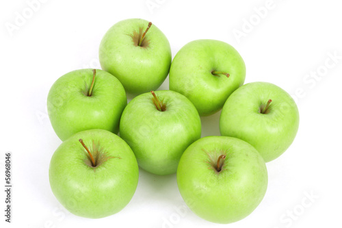 seven green apples isolated on a white background
