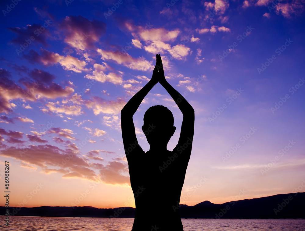 Silhouette yoga prayer pose