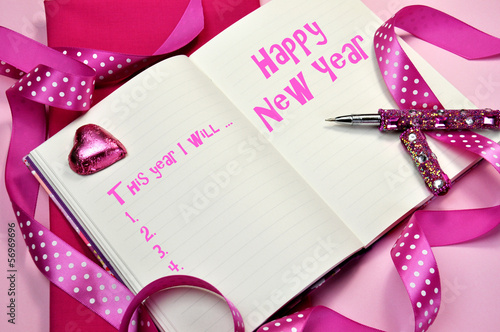 Pink Happy New Year resolutions in diary journal book photo