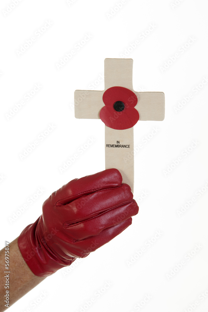 Fototapeta premium Glove and Remembrance Day cross with poppy