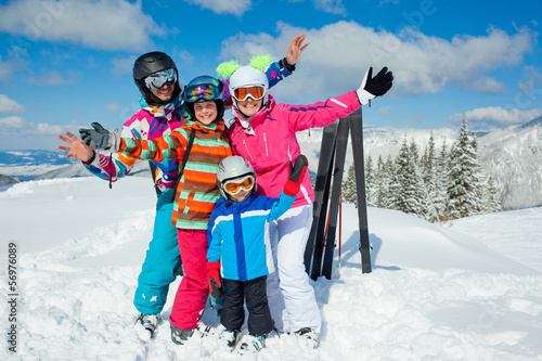 Skiing winter fun. Happy family