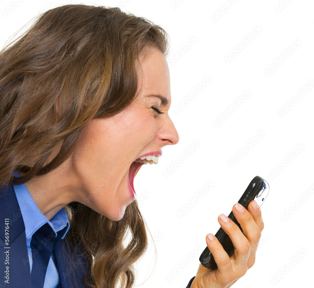 Angry business woman shouting in mobile phone Angry business woman shouting in mobile phone