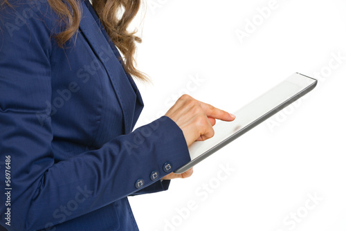 Closeup on business woman working on tablet pc