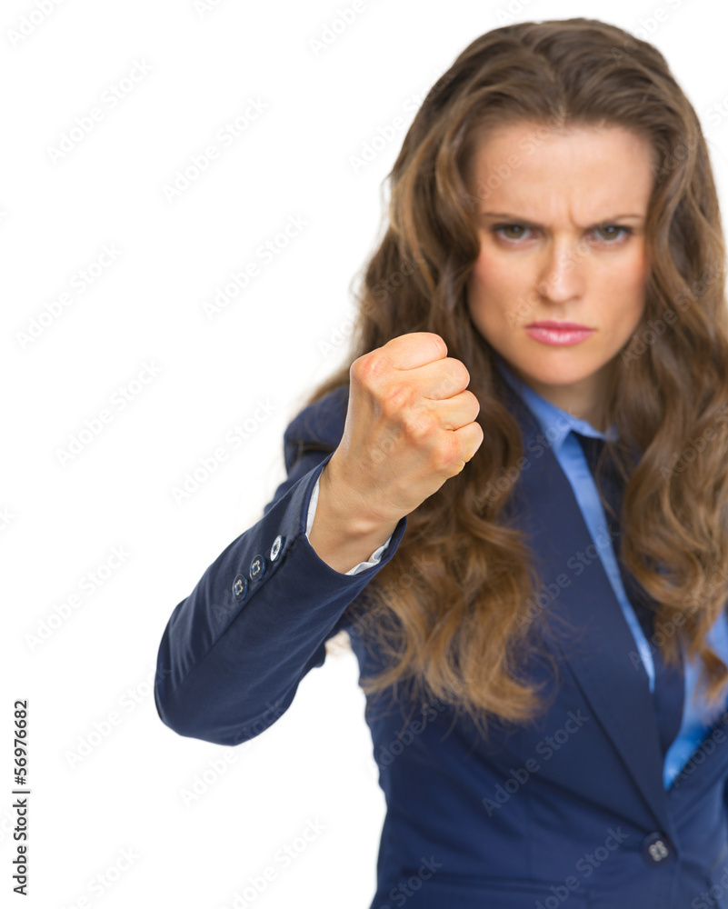 Angry business woman threatening with fist Angry business woman threatening with fist
