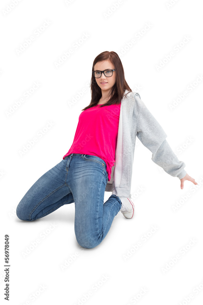 Smiling young woman making hip hop pose